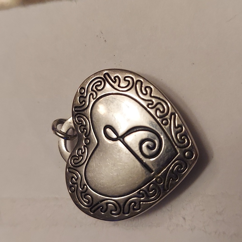 Magnetic locket heart pendant.